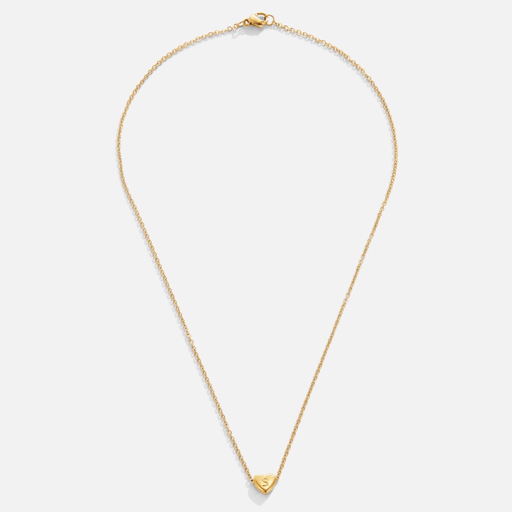 Letter Heart Necklace, flat lay of a gold chain necklace with a small heart pendant engraved