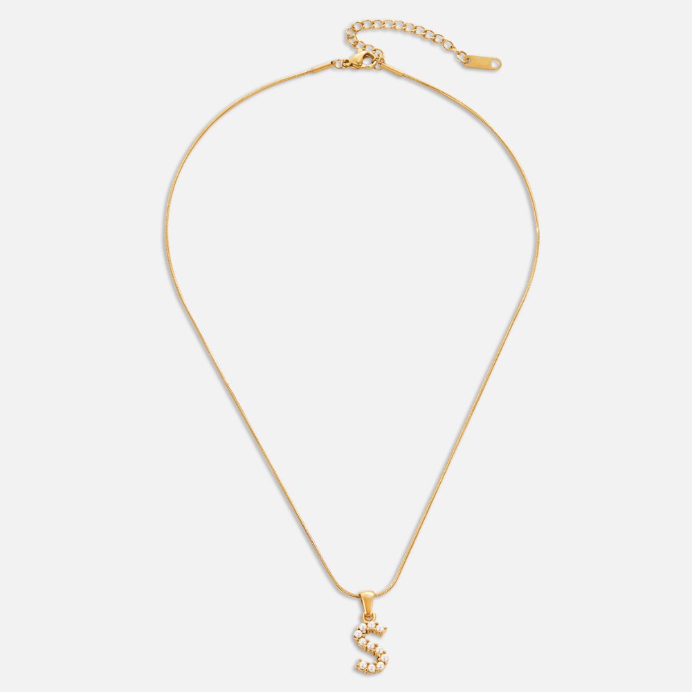 Letter Pearl Charm Necklace, flat lay of gold chain with pearl-studded letter S pendant