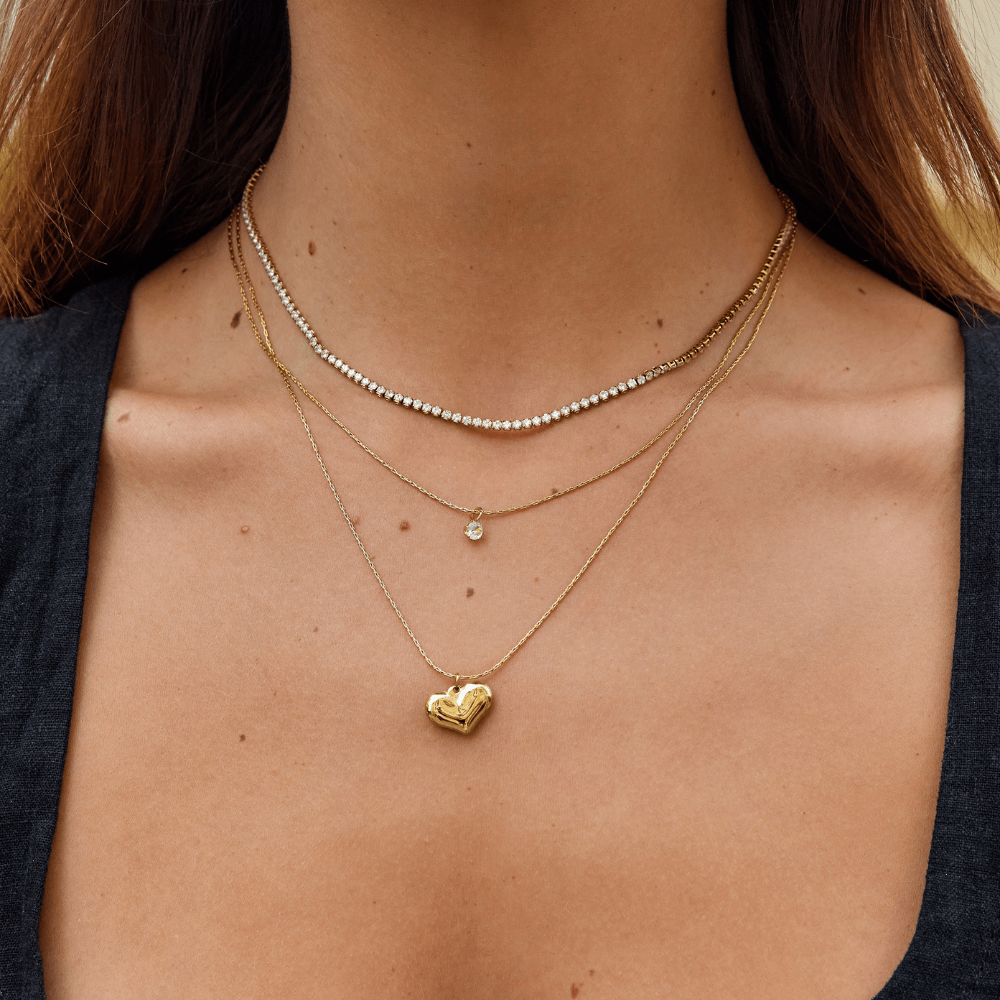 Cordelia Gold Crystal Necklace, worn at the neck, layered with two gold chains