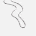 Cordelia Silver Crystal Necklace, flat-lay tennis chain of clear stones on light grey