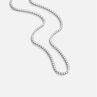 Cordelia Silver Crystal Necklace, flat-lay tennis chain of clear stones on light grey