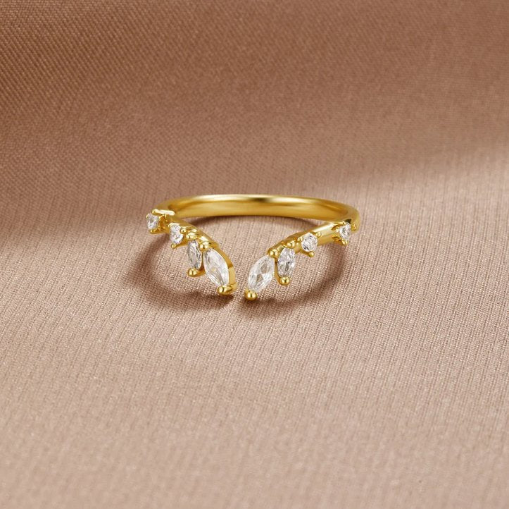 Lily Crystal Gold Vine Ring, gold ring with marquise and round clear stones on beige fabric