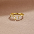 Lily Crystal Gold Vine Ring, gold ring with marquise and round clear stones on beige fabric