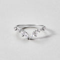 Lily Crystal Silver Vine Ring, silver ring with marquise and round stones on a grey surface