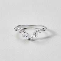 Lily Crystal Silver Vine Ring, silver ring with marquise and round stones on a grey surface