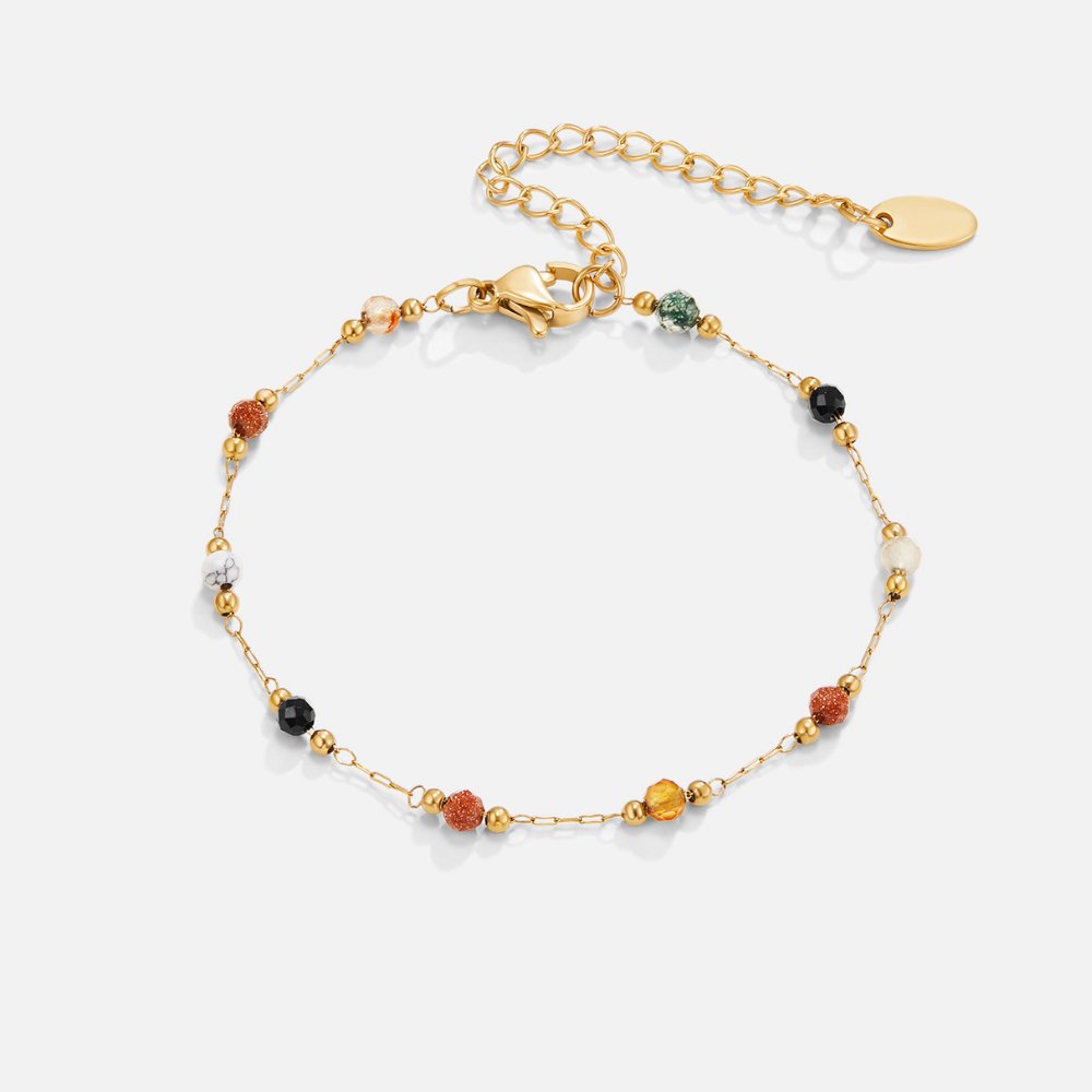 Lulu Beaded Stone Bracelet, flat lay of a gold chain bracelet with multicoloured beads and a