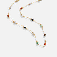Lulu Beaded Stone Necklace, laid out flat on a white surface, gold chain with coloured stone
