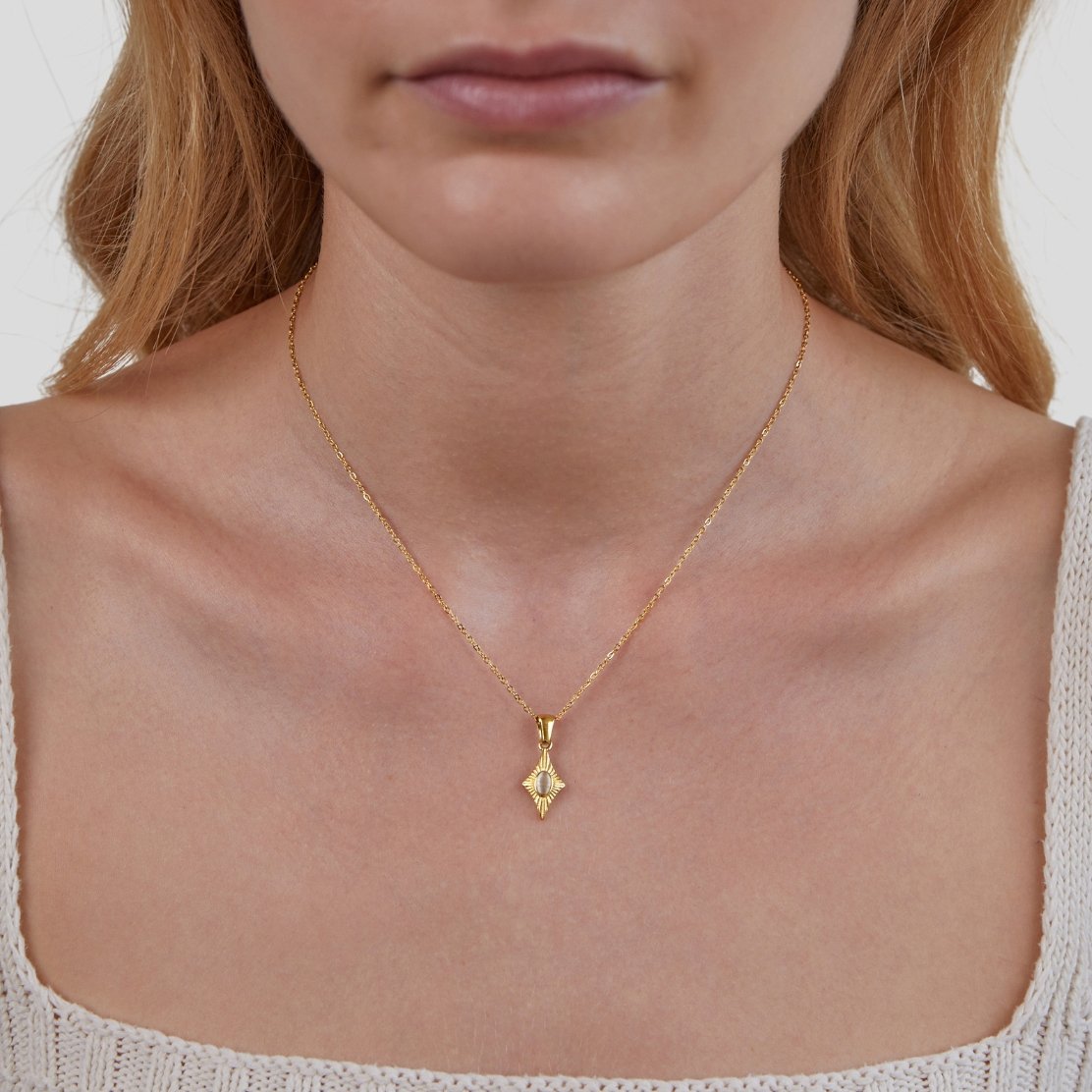 Luna White Opal Gold Necklace, worn on a neck with a fine gold chain, close-up