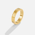Mari Heart Gold Ring, standing gold band on white, with heart cutouts and small crystal stones