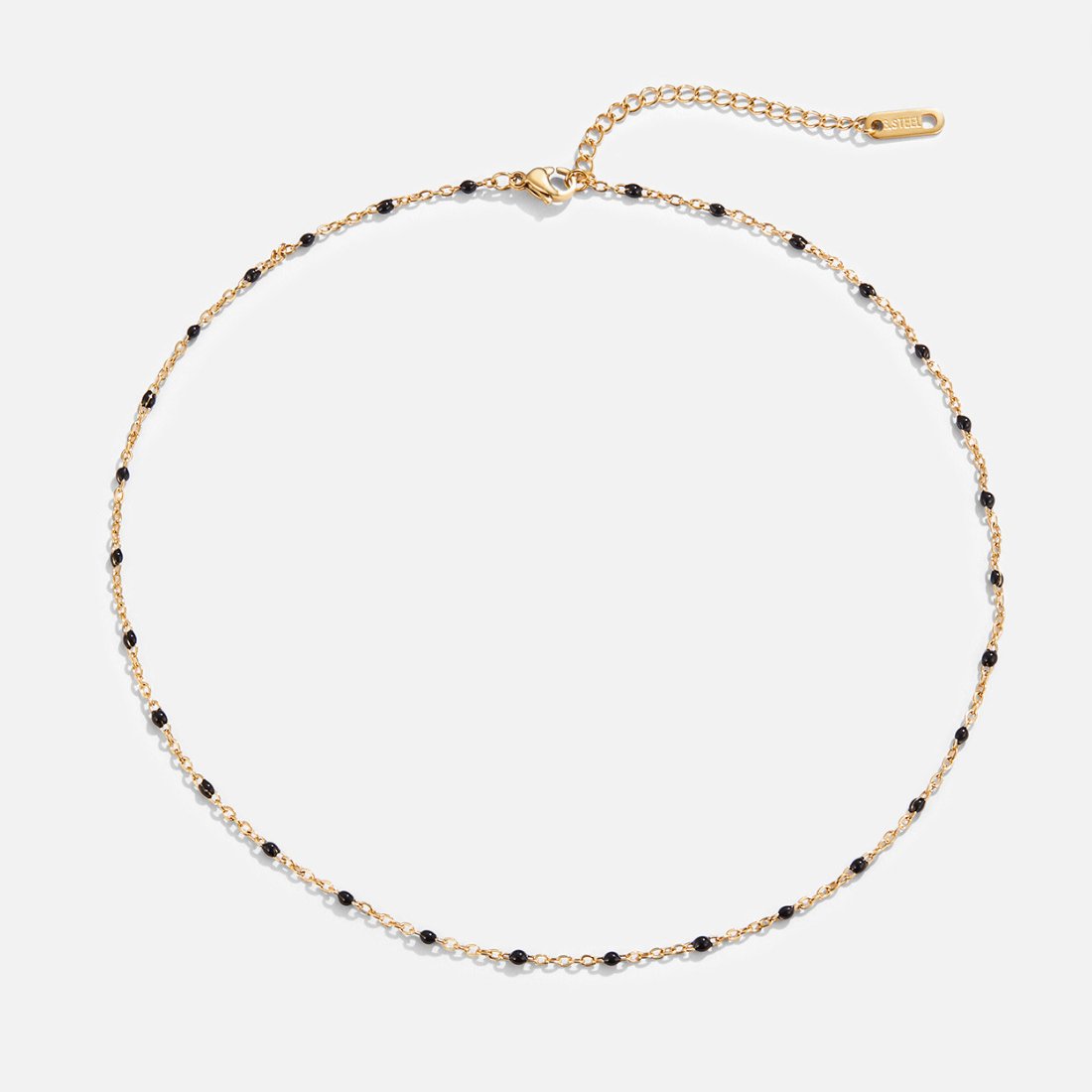 Mila Black Bead Necklace, flat lay of a gold chain with small black beads, clasp at top