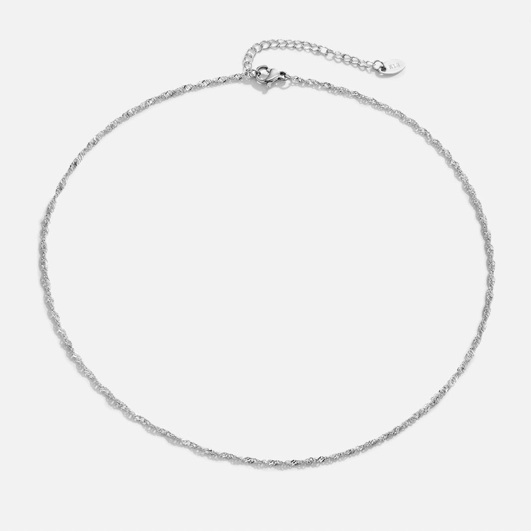 Mila Twist Silver Chain Necklace, laid flat on a white background, with a lobster clasp and