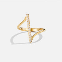 Mila Twisted Gold Ring, standing ring on white background, gold with a row of clear stones