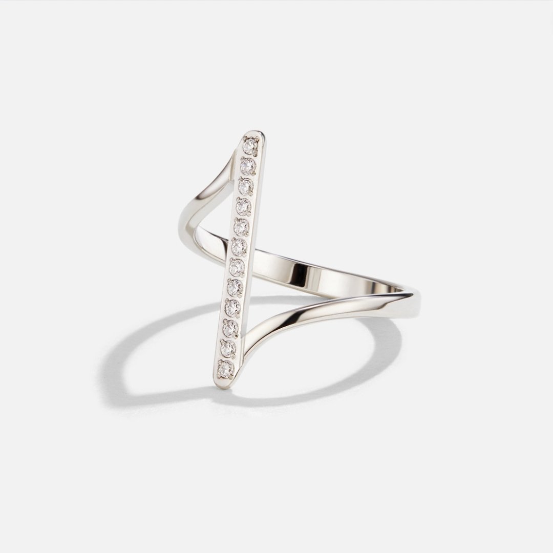 Mila Twisted Silver Ring, silver ring on a plain background, with a vertical row of small stones