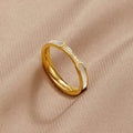 Mother Of Pearl & Crystal Ring, gold ring on beige fabric, white inlay and crystals visible