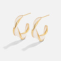Mother of Pearl Twist Hoop Earrings, a pair of open hoops on a plain background, gold twisted