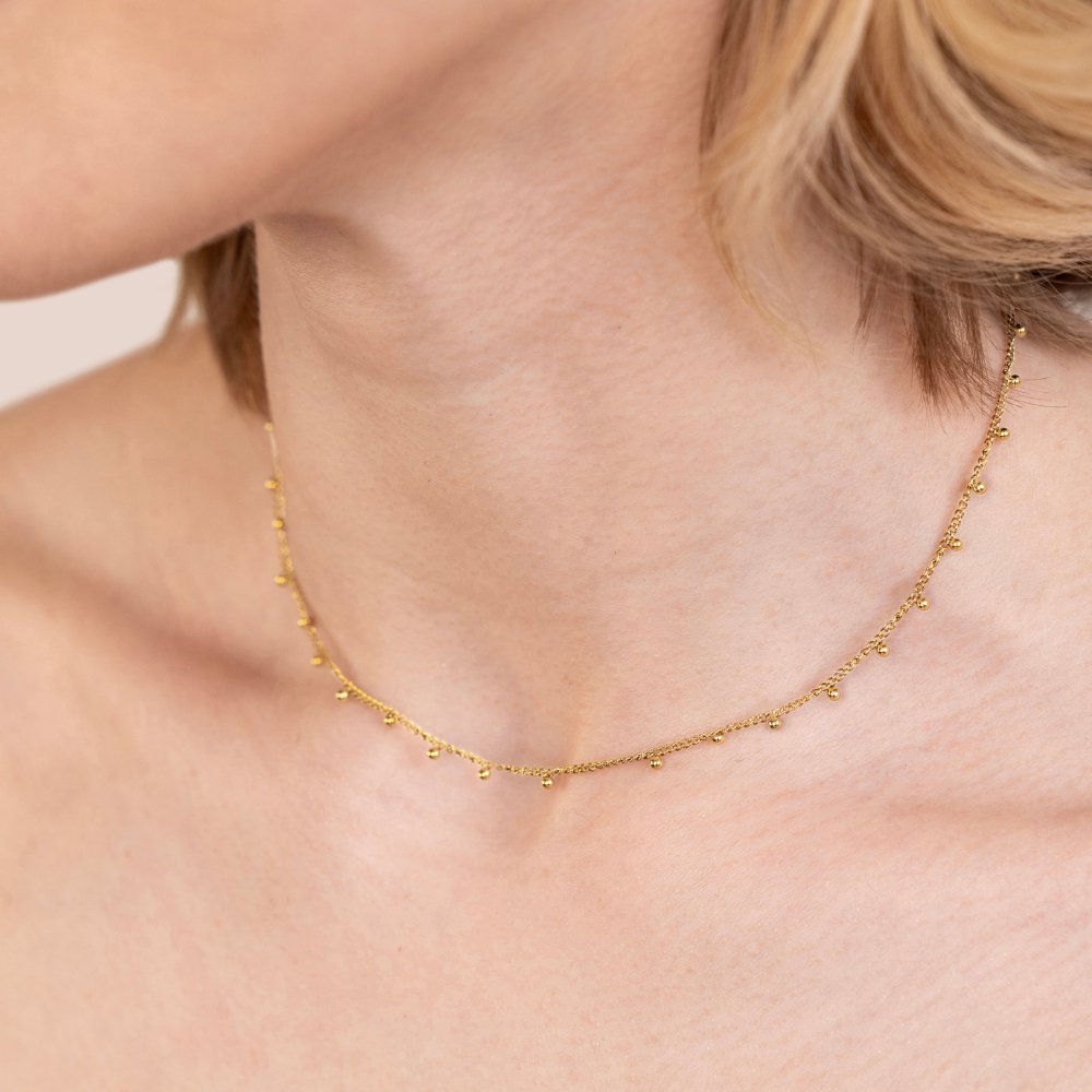 Nylah Bead Necklace, worn on a neck, close-up of a fine gold chain with small beads