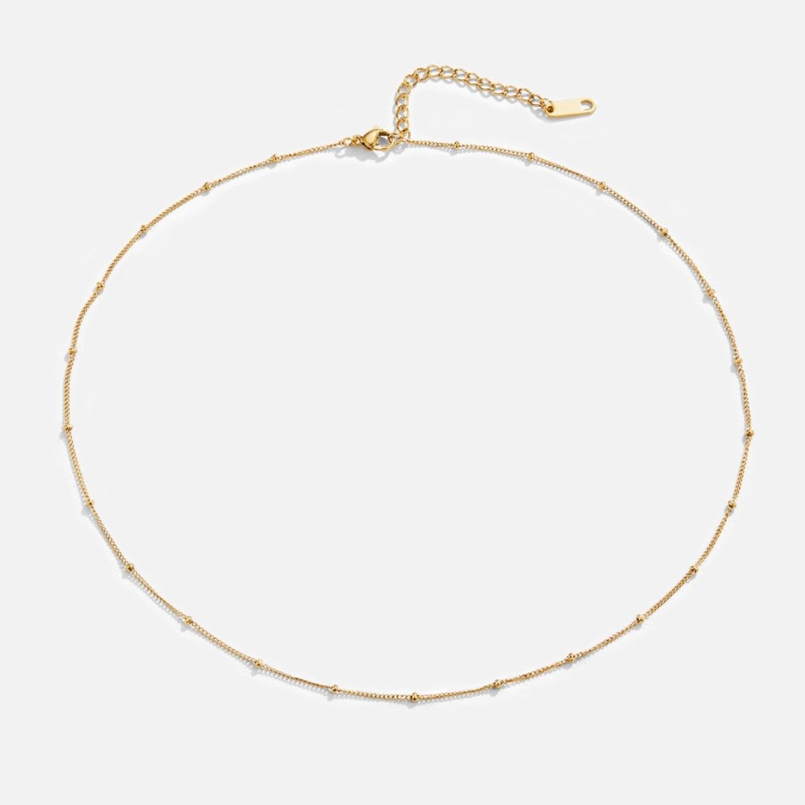 Ocean Lover Shell & Bead Necklace Set, laid flat on white, thin gold chain with small beads