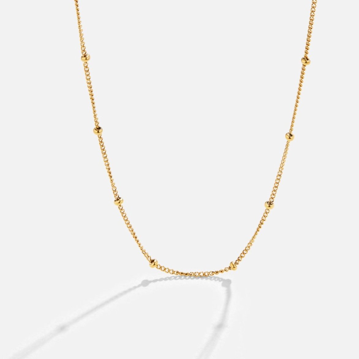 Ocean Lover Shell & Bead Necklace Set, gold chain necklace with small beads on white background