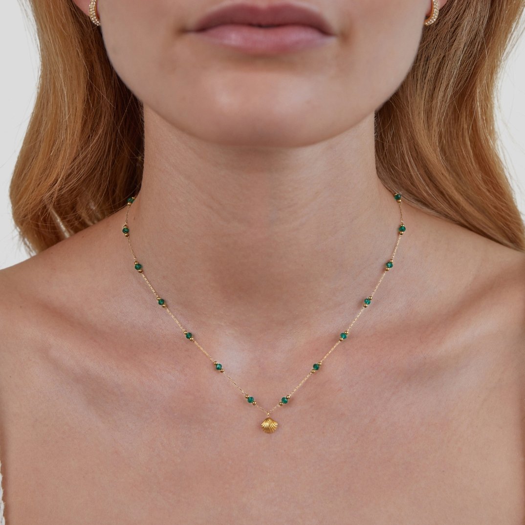 Ocean Lover Shell & Bead Necklace Set, worn on a neck with green beads and a gold shell pendant