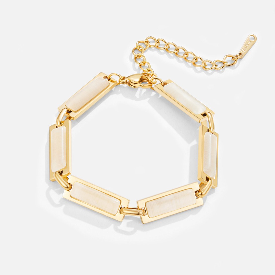 Opal Gold Baguette Bracelet, gold bracelet laid flat with cream stone panels and extender chain