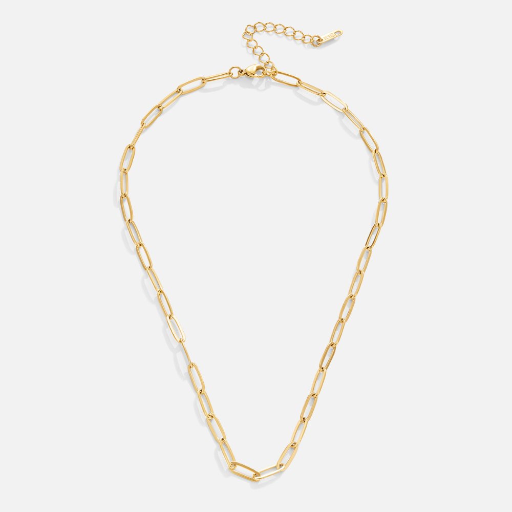 Paperclip Gold Necklace, gold paperclip chain laid flat on a white background, with extender chain