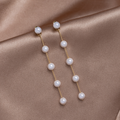 Pearl Drop Earrings, pair of long drop earrings on satin, with pearls on gold chain