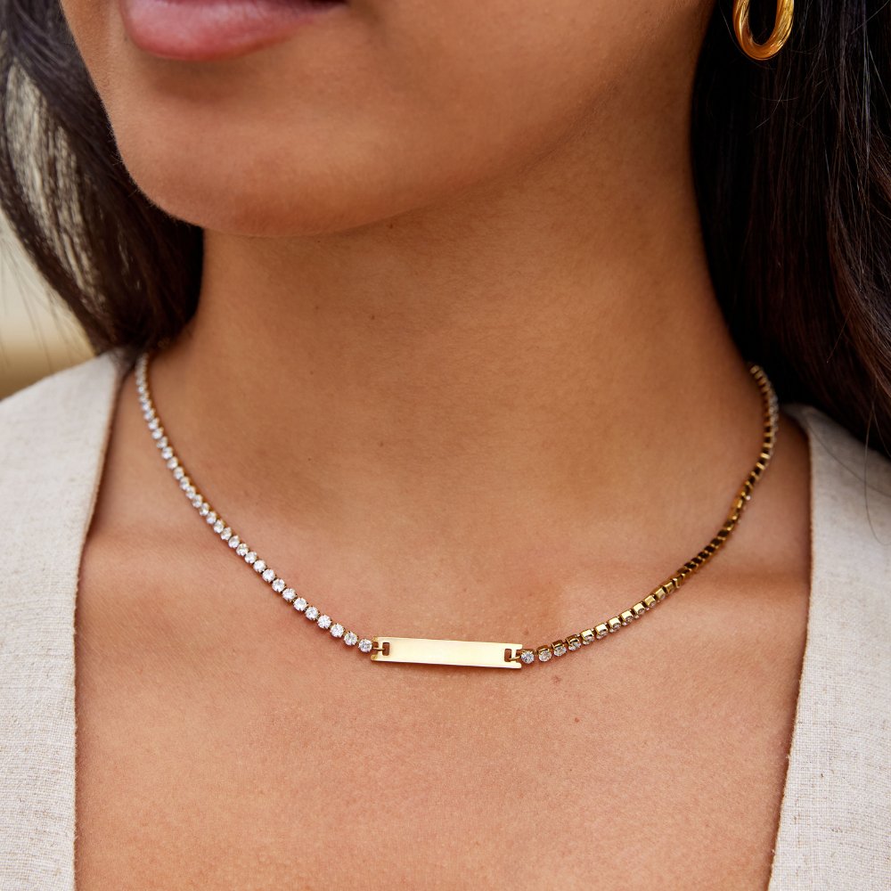 Rina Crystal Necklace, worn on a neck with a gold hoop earring visible