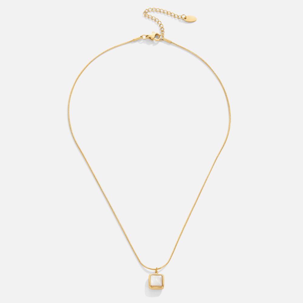 Riva Moonstone Pendant Necklace, laid flat on white, gold chain with square white pendant