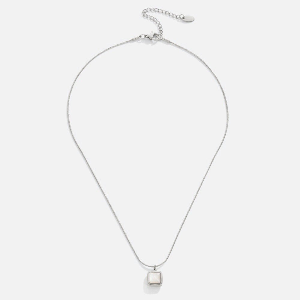 Riva Moonstone Pendant Necklace, laid flat on white, silver chain with square white pendant