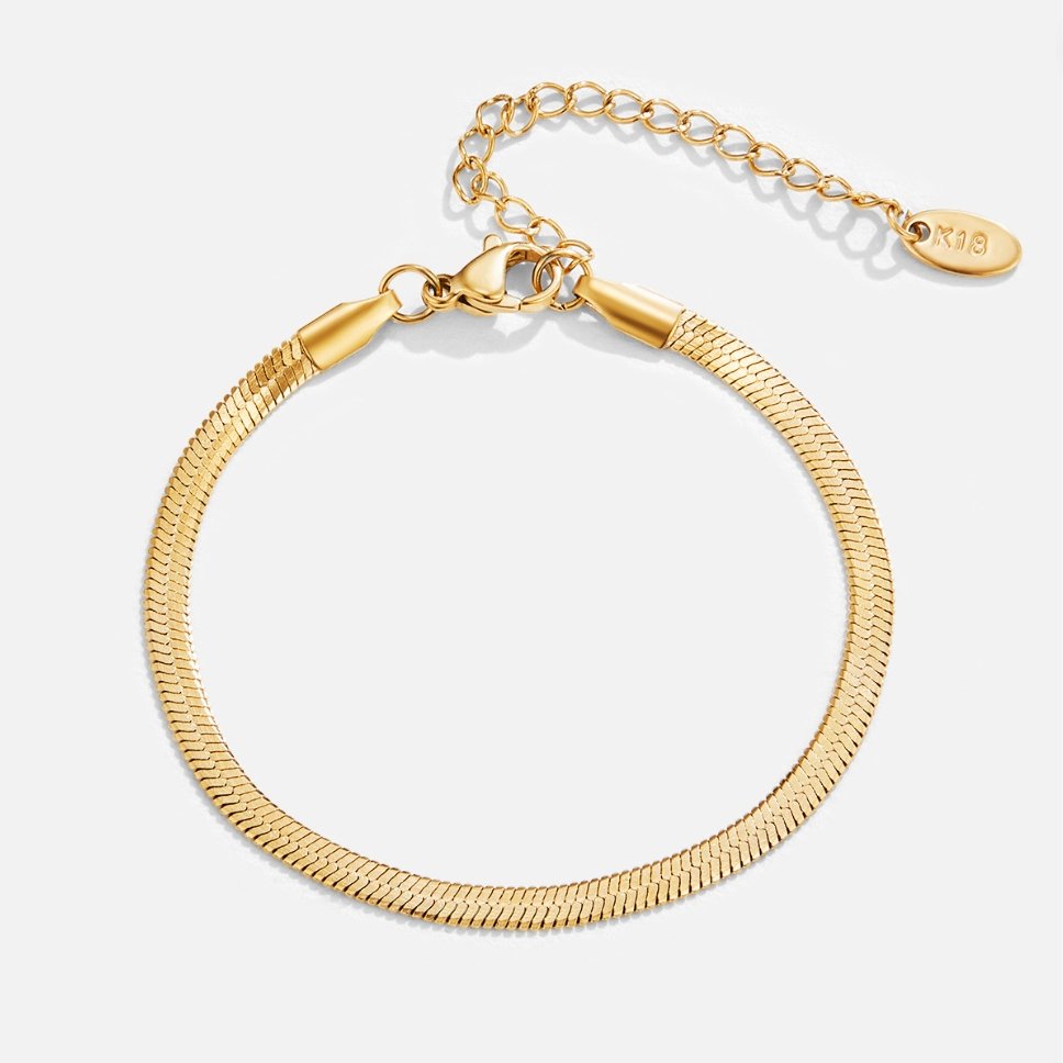 Sarya Snake Chain Gold Bracelet, flat-lay of gold herringbone bracelet with extender chain and