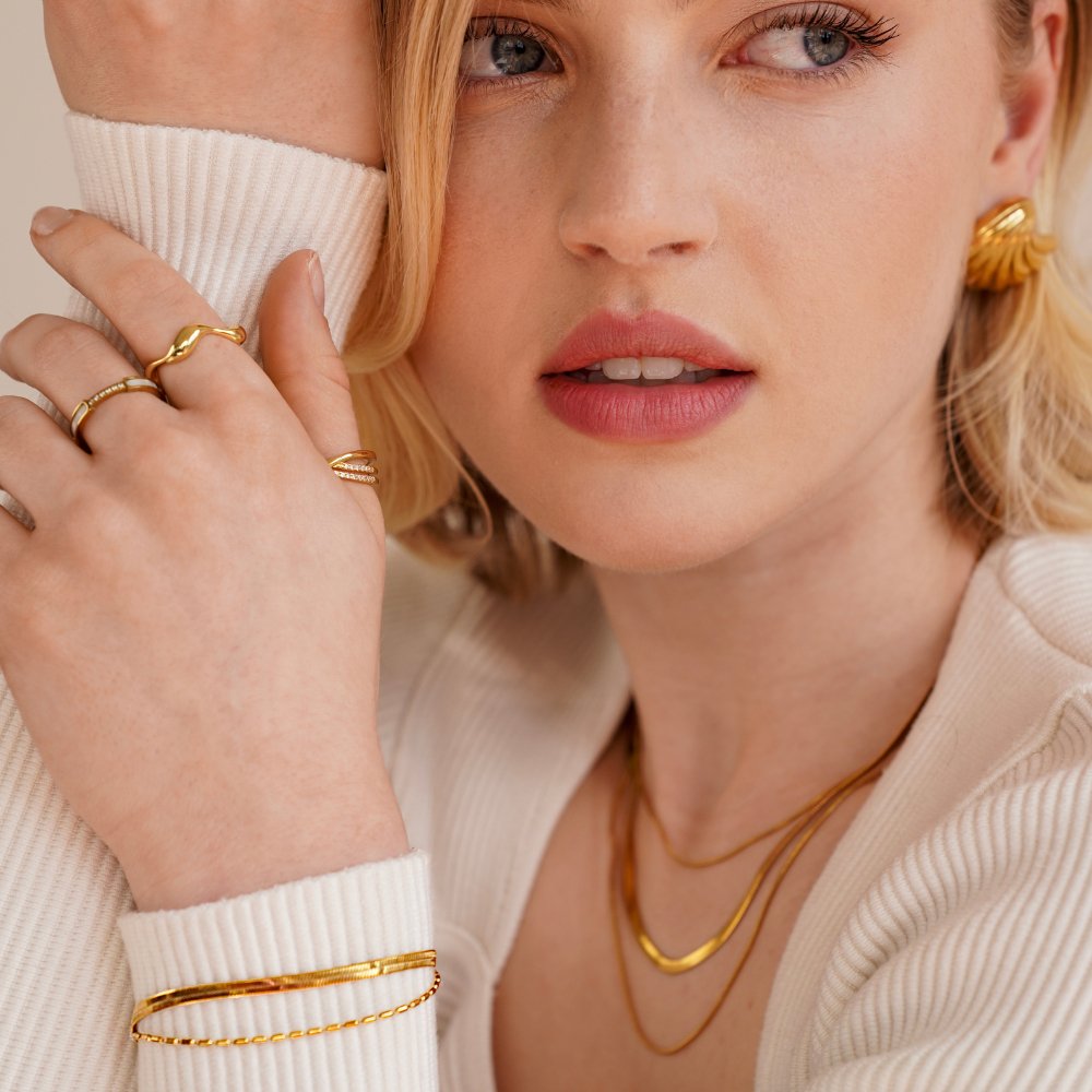 Selene Snake & Bead Chain Bracelet, worn by a model with gold rings, earring and layered necklaces