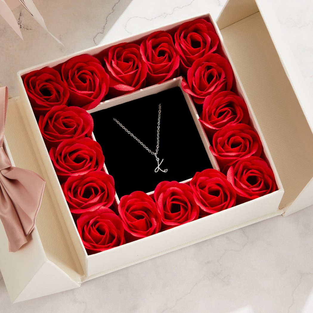 Silver Letter Heart Necklace, in a box lined with red roses, on black velvet insert
