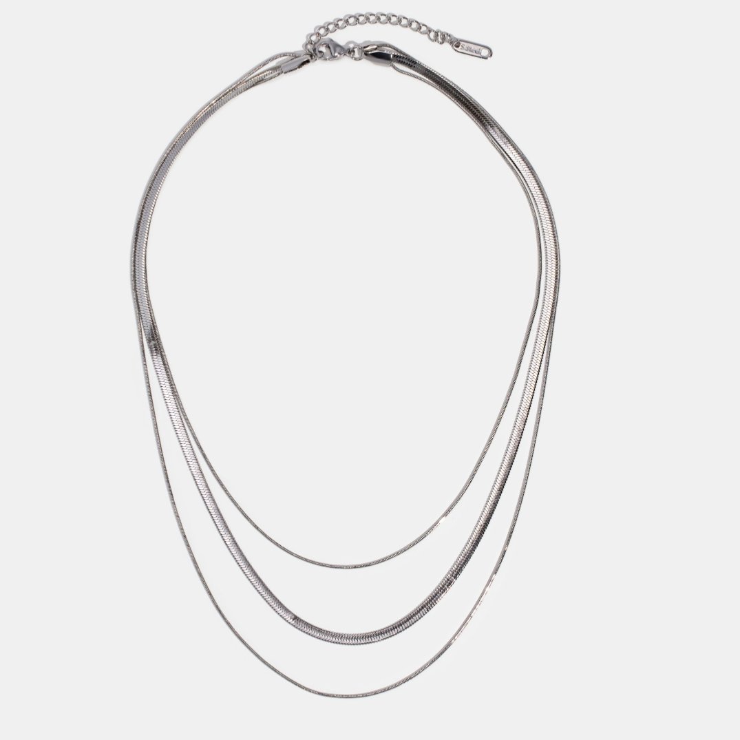 Silver Multi-Layered Chain Necklace, flat lay of three layered silver snake chains with a clasp
