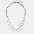 Silver Multi-Layered Chain Necklace, flat lay of three layered silver snake chains with a clasp