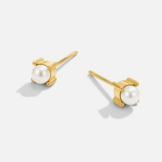 Free Sofia Pearl Stud Earrings, pair of gold stud earrings with small white pearls on a light background