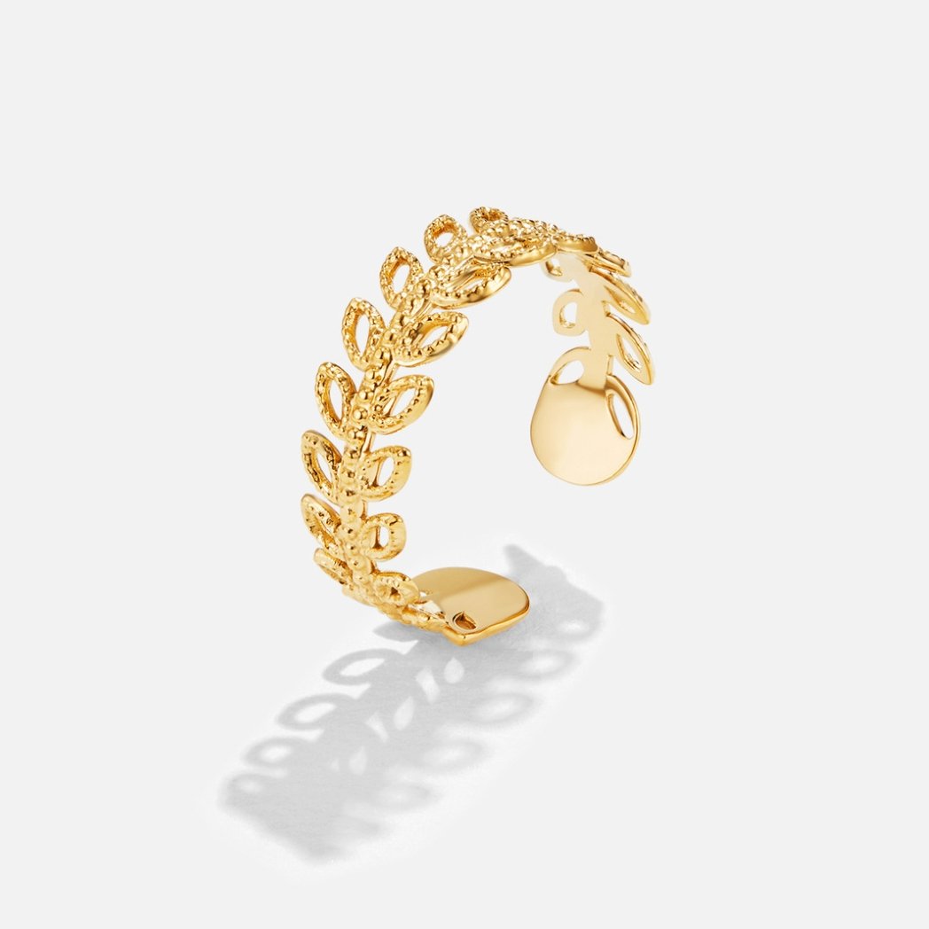 Summer Bloom Leaf Ring, open gold ring with leaf-pattern band on white background
