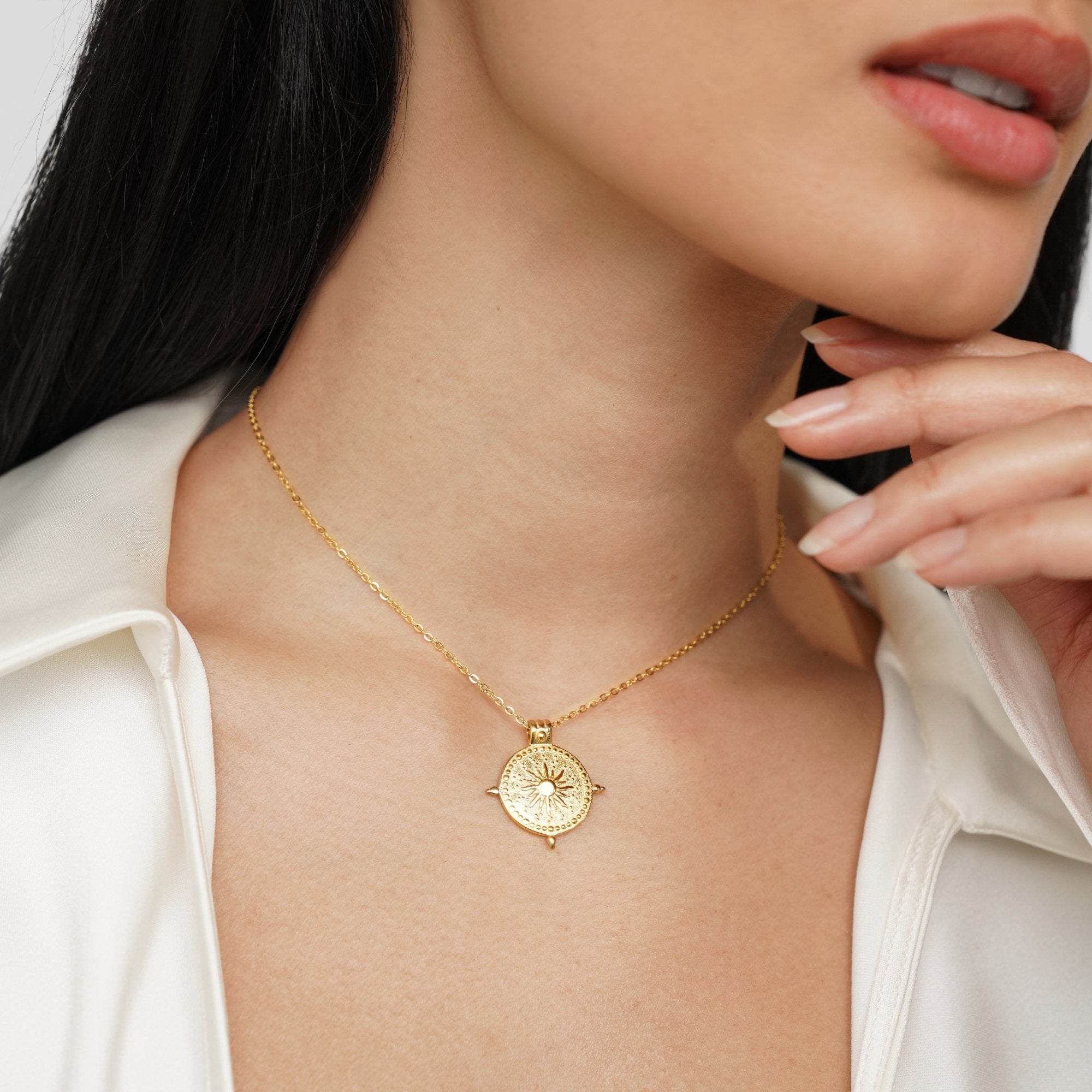 Summer Solstice Gold Necklace, worn on a model's neck with a white satin shirt