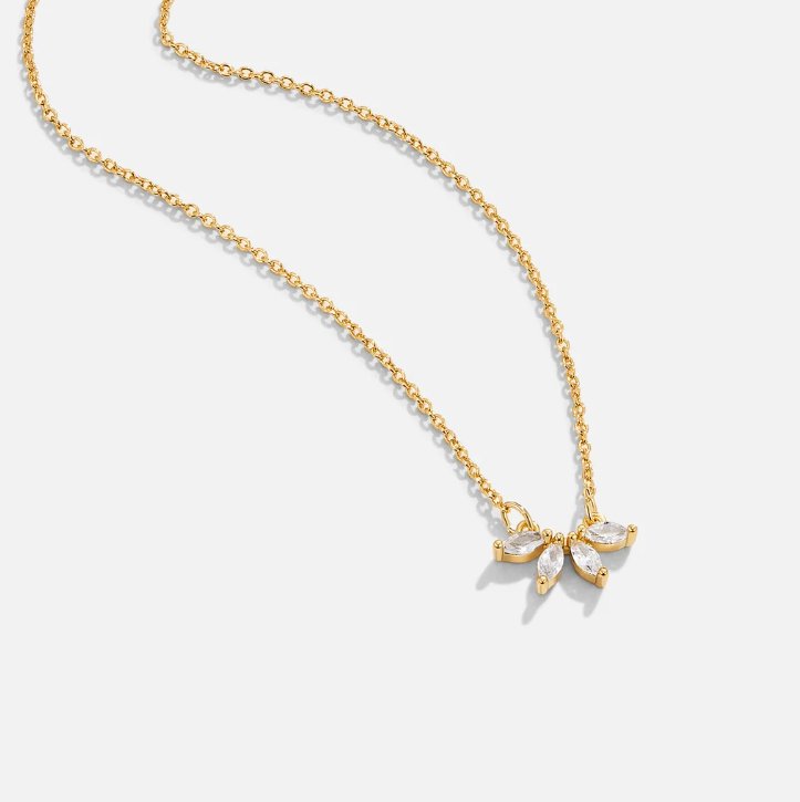 Tiffany Crystal Leaf Pendant Necklace, gold chain laid out on white with a clustered crystal