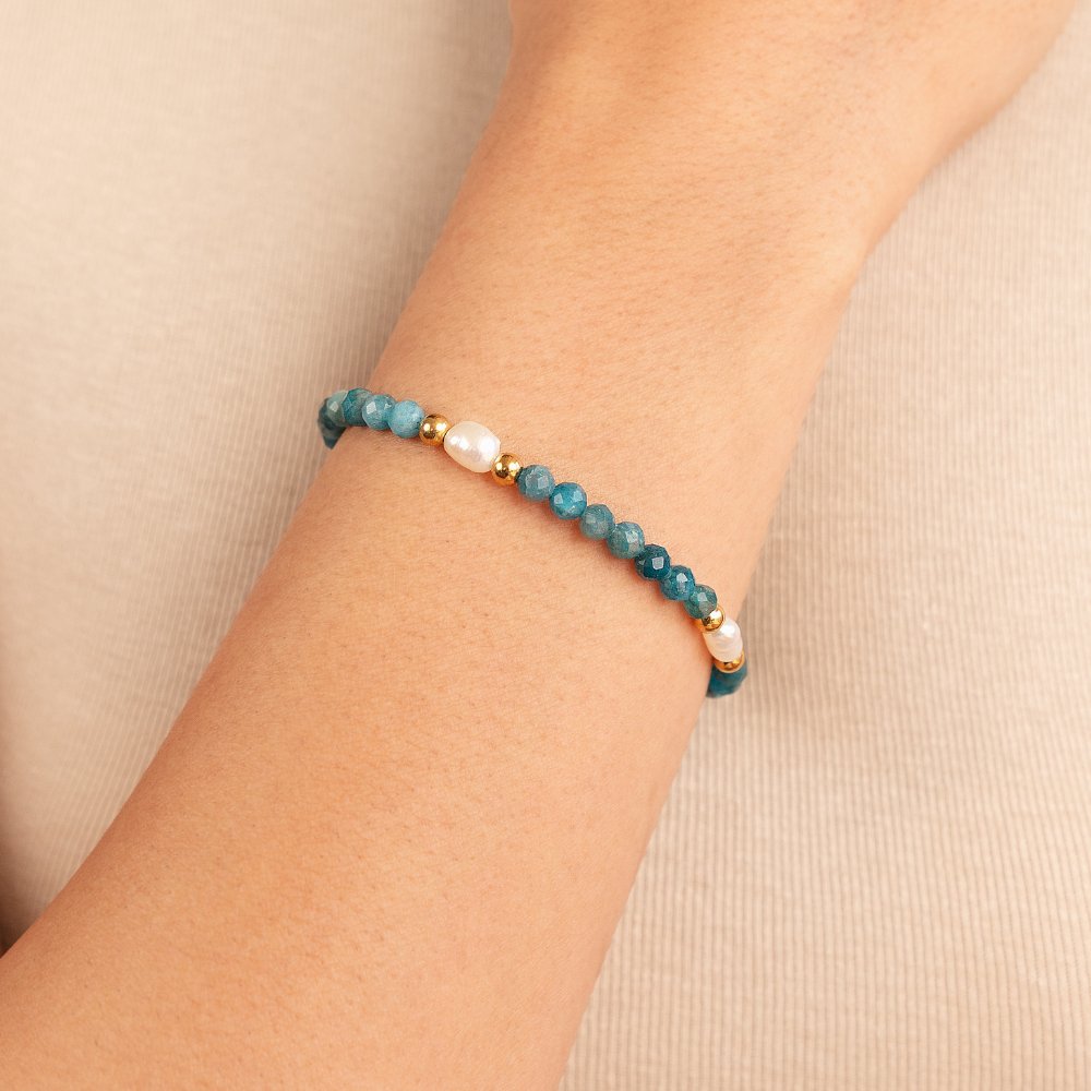 Turquoise Blue & Pearl Bead Bracelet, worn on a wrist with faceted teal beads and pearls