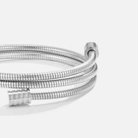 Twisted Silver Bracelet, coiled silver bracelet with ribbed ends on a plain white background