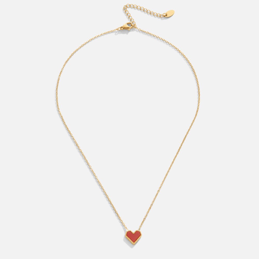 Valentina Heart Necklace, flat lay of a gold chain with a small red heart pendant