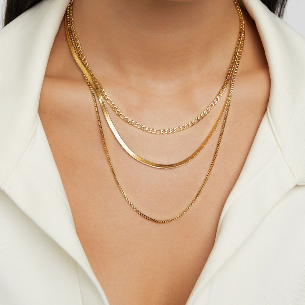 Vienna Layered Chain Necklace, worn layered on a neck over a white collared top
