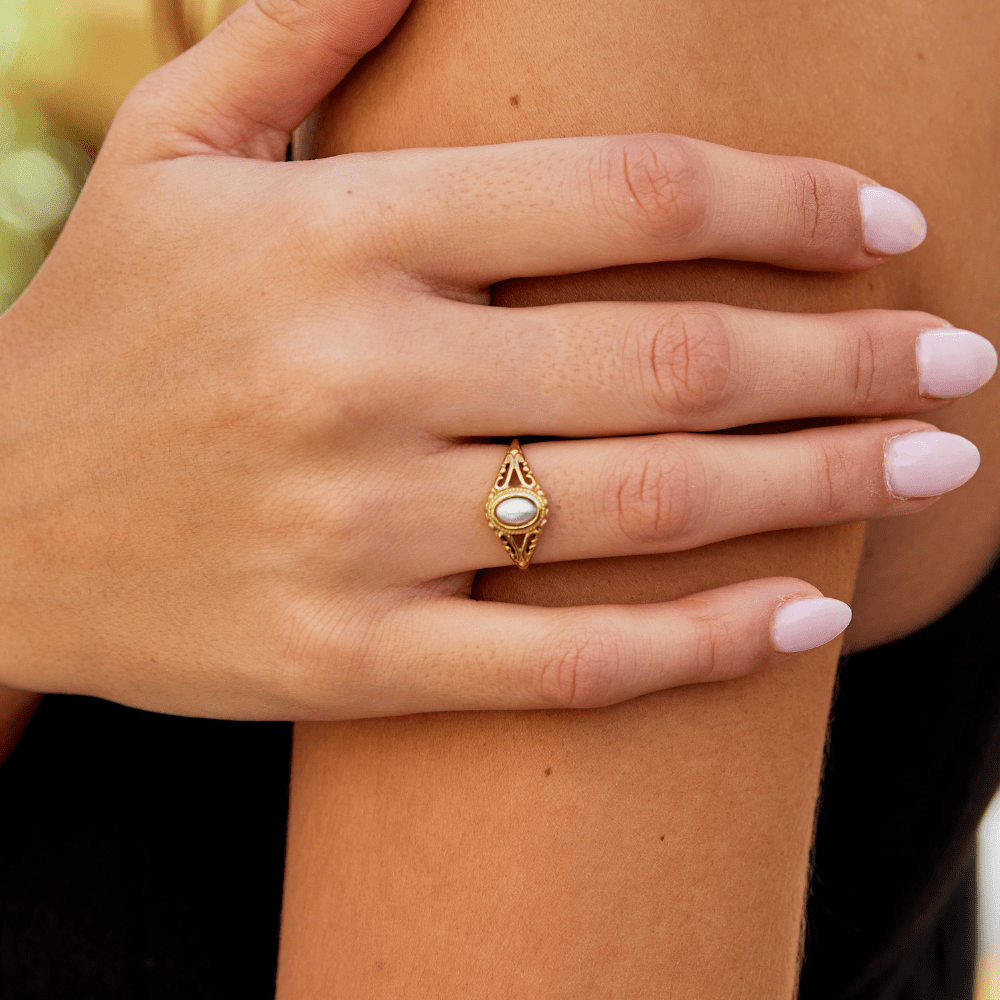 Vintage Royal Pearl Ring, worn on a hand with pale pink nails, gold filigree band