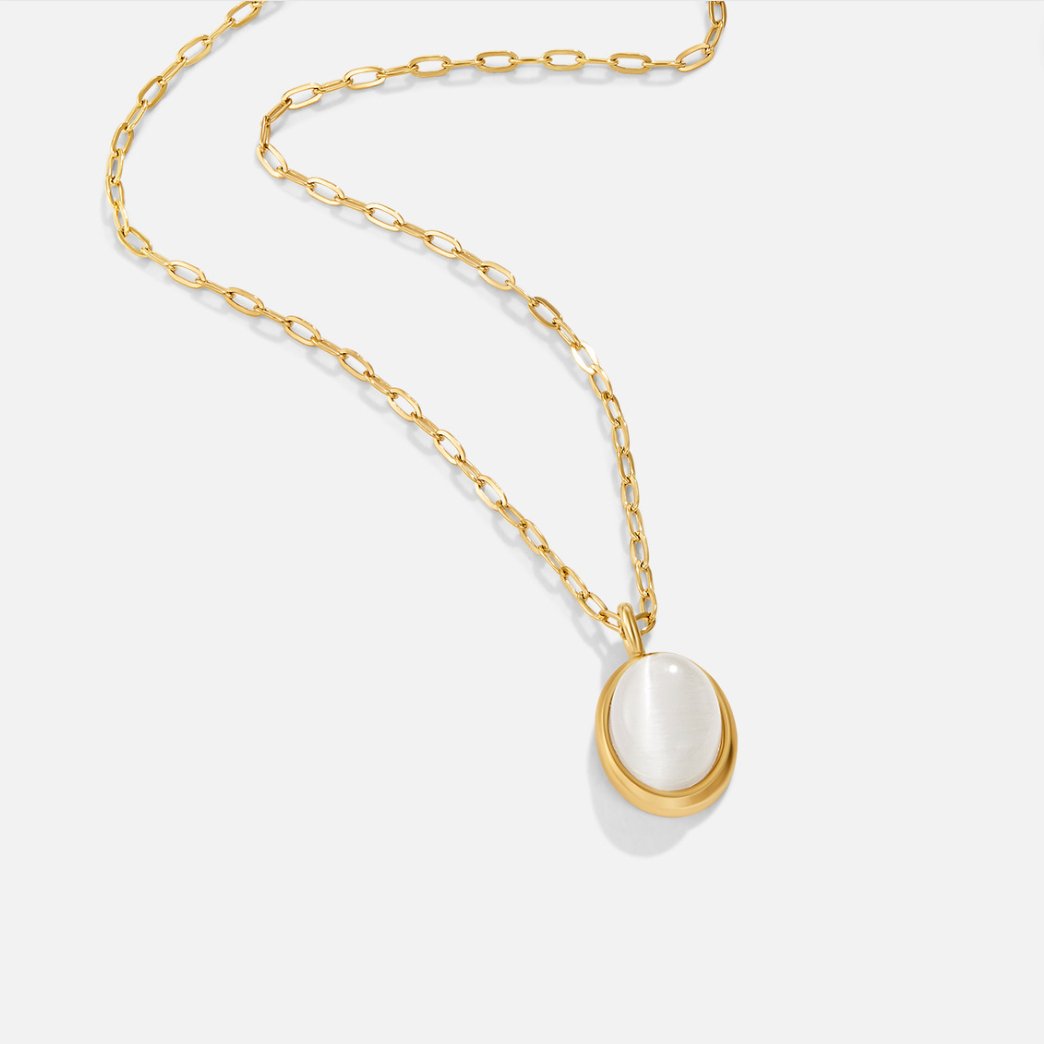 White Opal Necklace, gold paper-clip chain with an oval white stone pendant on white